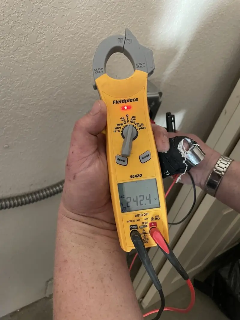 Voltage testing with clamp meter during Whole House Surge Protector in Coos Bay